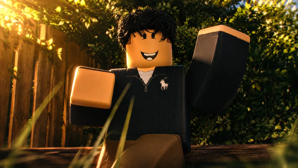 CeeburJR's avatar in a black ribbed sweater waving to camera, golden sunlight through autumn foliage, wooden fence and soft bokeh.